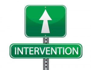 Sign with an arrow and the word intervention