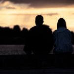 Silhouetted,Loving,Couple,At,Sunset.