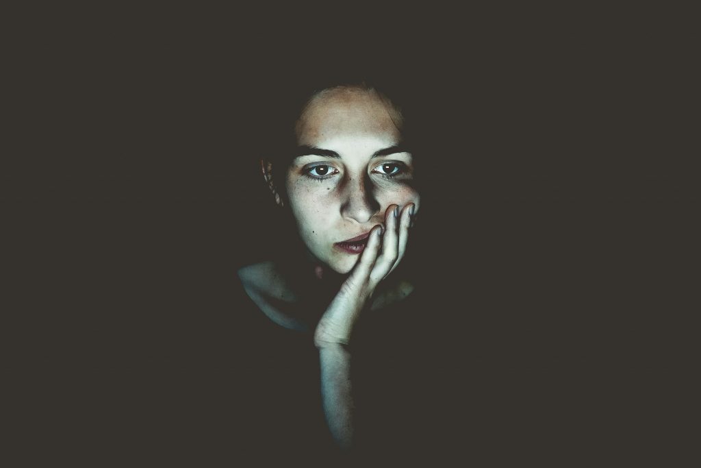 Woman's face lit by computer screen